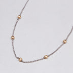 White Gold Station Necklace with Yellow Gold Balls