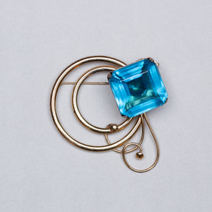 Vintage Gold Swirl Brooch with Blue Stone