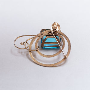 Vintage Gold Swirl Brooch with Blue Stone