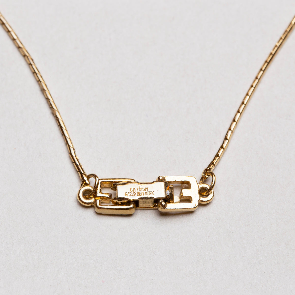 Vintage Givenchy Gold Pendant Necklace with Multicolor Crystal Inlay