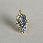 it is made from black diamond polished chips that are set on gold plated silver hand base