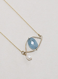 Claire van Holthe faceted aquamarine bead eye necklace with freshwater pearl teardrop set in 9 carat gold eye wire frame 