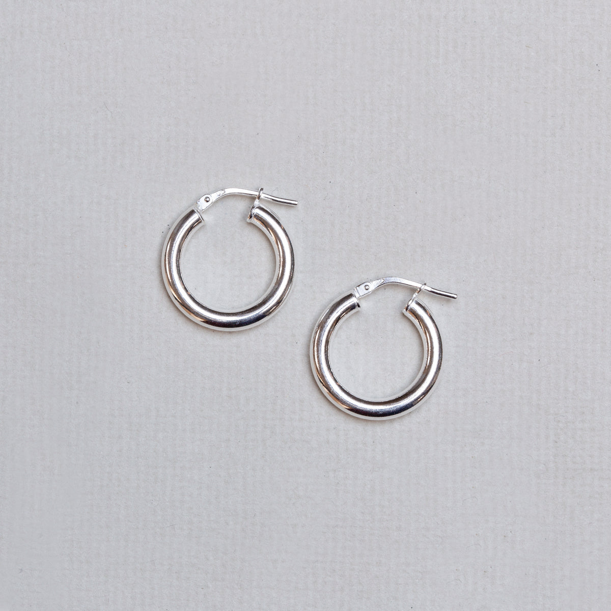 Tube Hinged Hoop Earrings in Gold & Silver