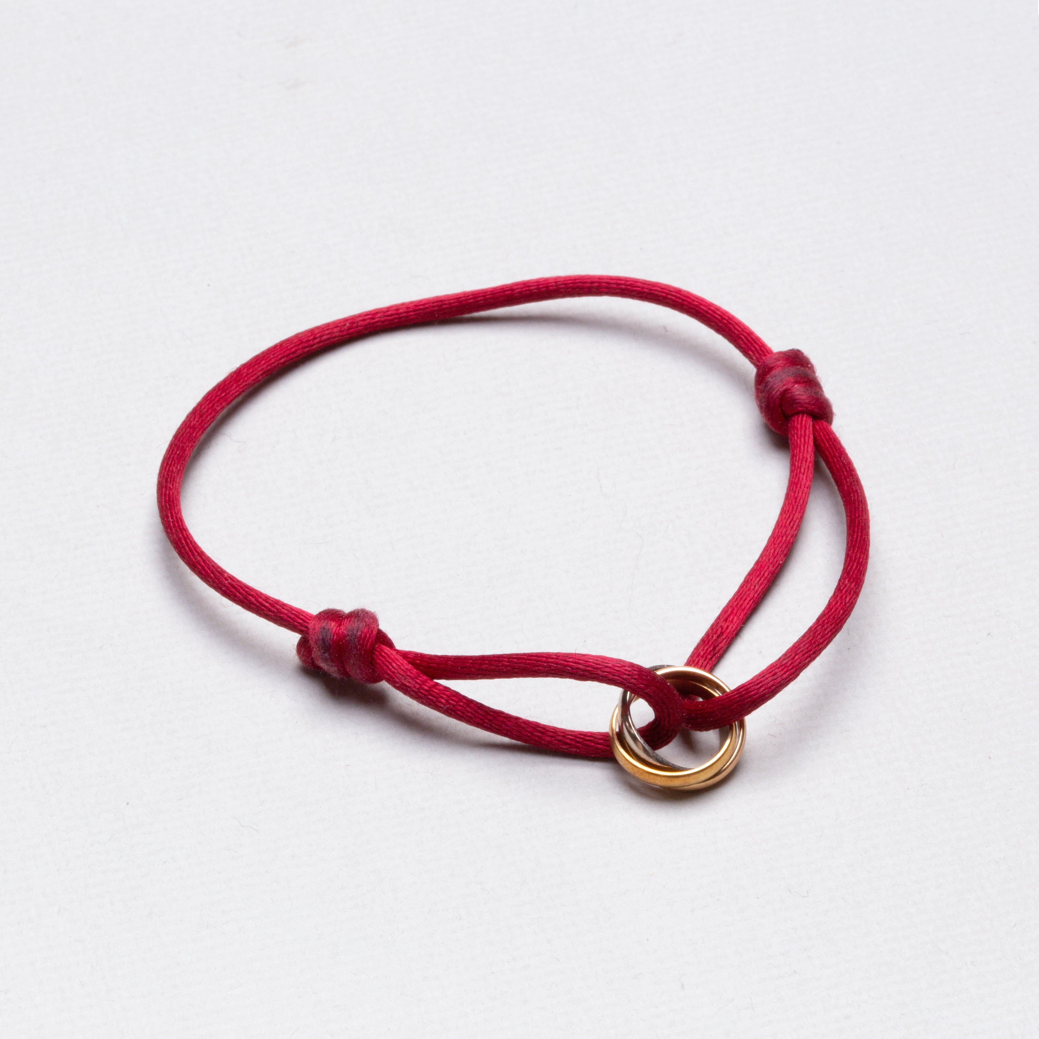 Cartier trinity bracelet top red cord