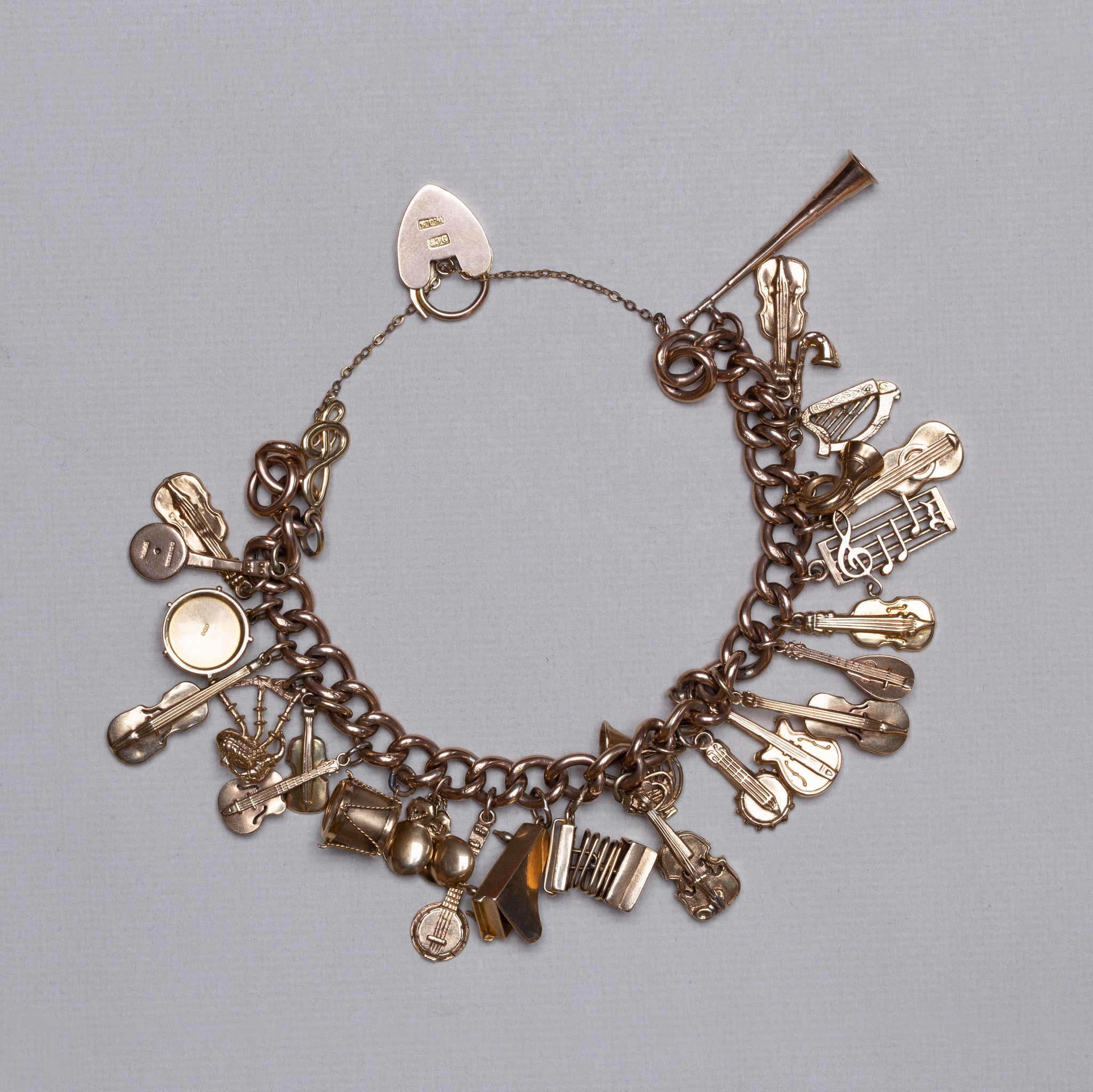 Vintage 9ct Gold Curb Chain Bracelet with Musical Instrument Charms - felt