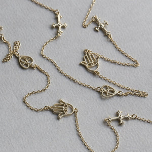 detail of the filigree heart, cross and hand station necklace 