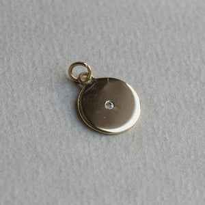 the disc is handmade and it matches our inexpensive 9 carat gold chain also available on feltlondon.com