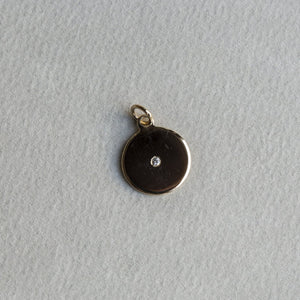 felt's own design - incredibly simple and enchanting polished gold disc with diamond