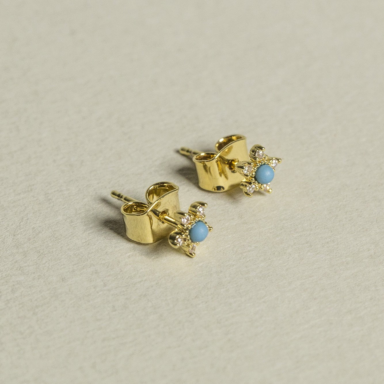 bright turquoise and sparkly crystals in a delicious gold frame - we present you Tai turquoise flower stud earrings