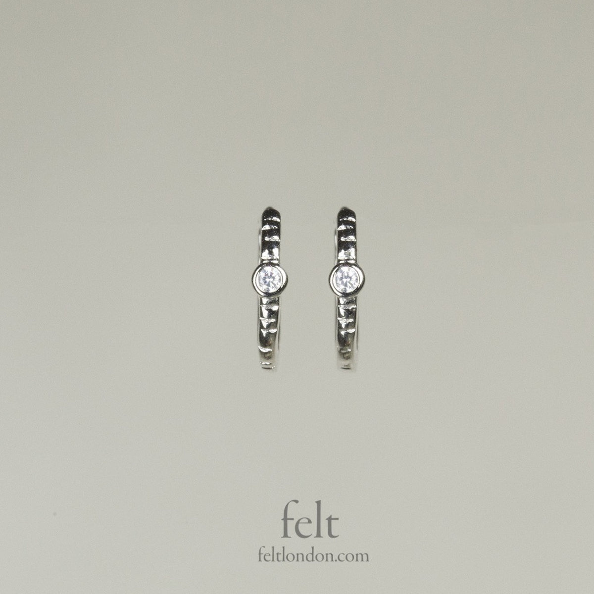 front view of "Single Stone Sleepers" in sterling silver