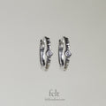Single stone sleepers in sterling silver with a single cubic zirconia 