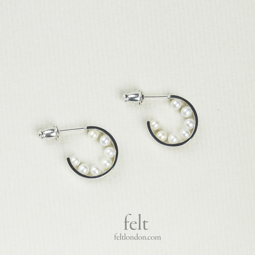astonishing, pearl lined silver hoops from e.m. Mehem