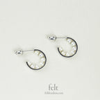 astonishing, pearl lined silver hoops from e.m. Mehem