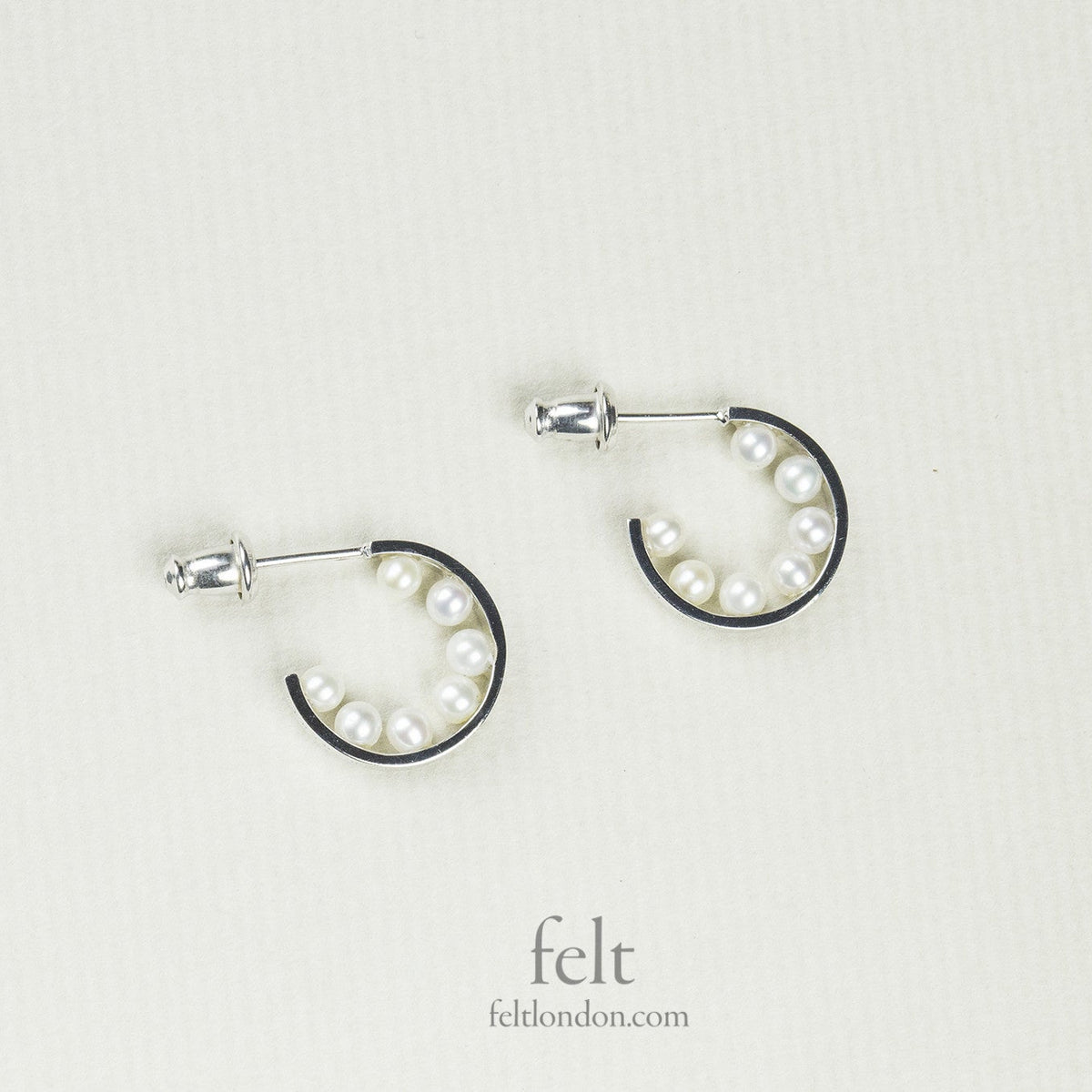 astonishing, pearl lined silver hoops from e.m. Mehem