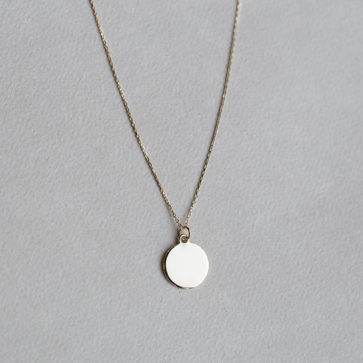 felt's own design - incredibly simple and enchanting polished gold disc 