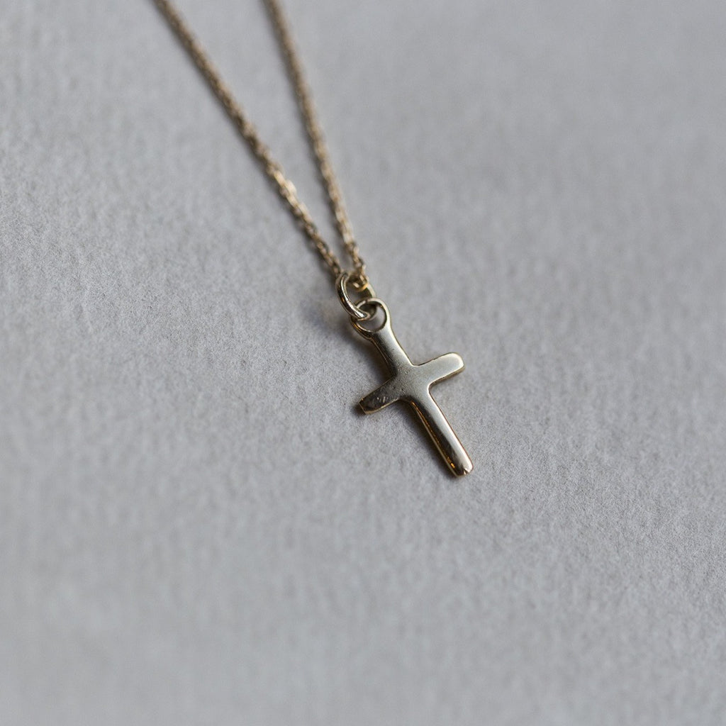 felt's very own design - adorable tiny cross pendant