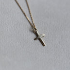 felt's very own design - adorable tiny cross pendant