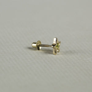 the yellow diamond star earring seen from the side