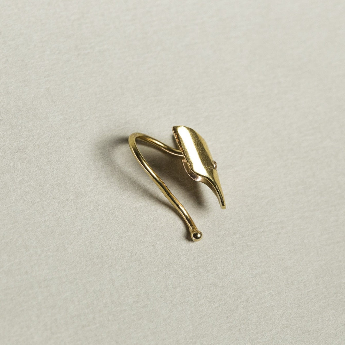 the sturdy wire is flexible enough to be adjusted to the rim of your ear