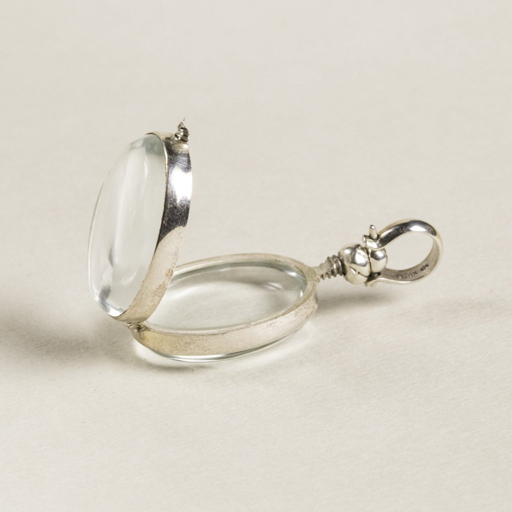 opened oval locket seen from the side - same screw design is used in the round lockets